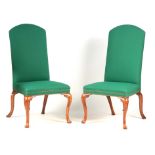 A PAIR OF QUEEN ANNE WALNUT UPHOLSTERED SIDE CHAIRS with arched high backs and stud work seats;