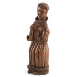 AN 16TH CENTURY ITALIAN CARVED WOOD SCULPTURE modelled as Saint Francis 40cm high