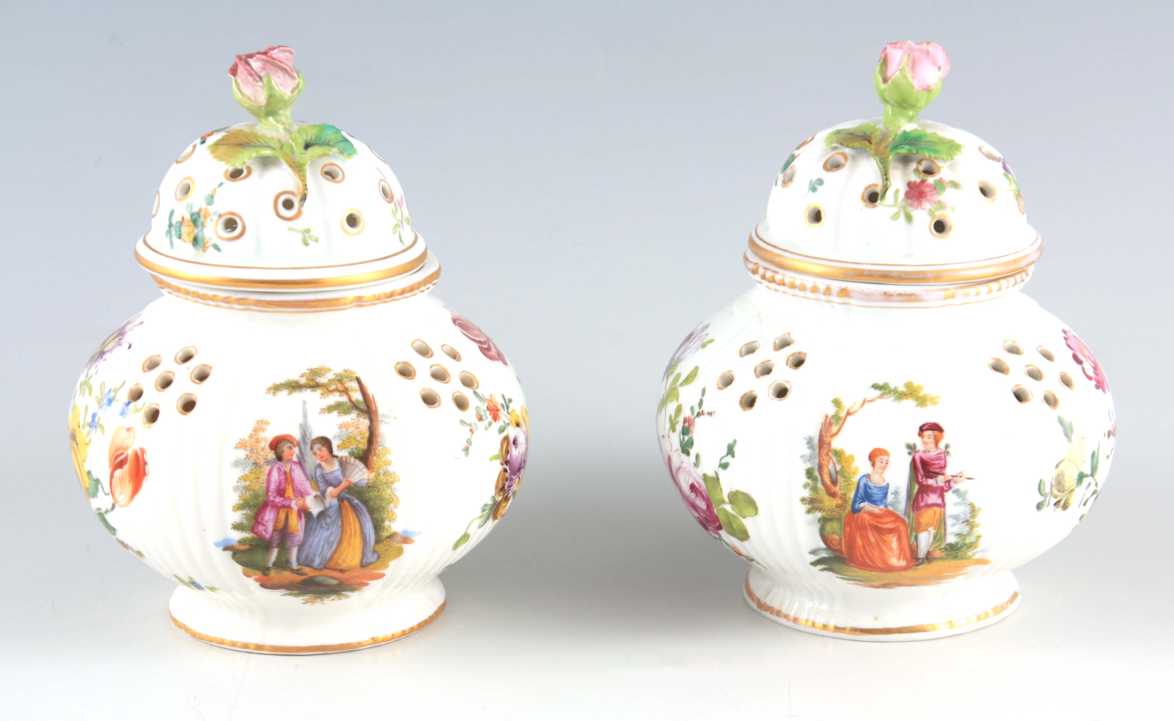 A PAIR OF 19TH CENTURY DRESDEN POT POURRI of reeded bulbous form decorated with rose finials and