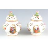 A PAIR OF 19TH CENTURY DRESDEN POT POURRI of reeded bulbous form decorated with rose finials and