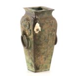 AN UNUSUAL CHINESE SHOULDERED VASE with mash head and loop handles, 22cm high.