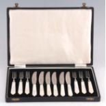 A MID 20TH CENTURY CASED SET OF SIX MOTHER OF PEARL FRUIT KNIVES AND FORKS by Cooper Bros and sons.