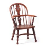 A 19TH CENTURY NOTTINGHAMSHIRE YEW WOOD CHILDS WINDSOR CHAIR with burr yew wood hooped back and