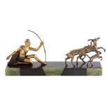 VOLTAS. A FRENCH ART DECO SILVERED AND GILT FIGURAL BRONZE modelled as a hunting scene mounted on