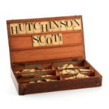 A 19TH CENTURY SCHOOL MASTERS ALPHABET SET the pine box with detachable lid and grooved sides