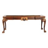 AN IMPRESSIVE 19TH CENTURY MAHOGANY AND PARCEL GILT SERVING TABLE OF LARGE SIZE the figured mahogany
