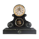 A LATE 19TH CENTURY FRENCH BLACK SLATE AND GREEN MARBLE MANTEL CLOCK the arched top case with