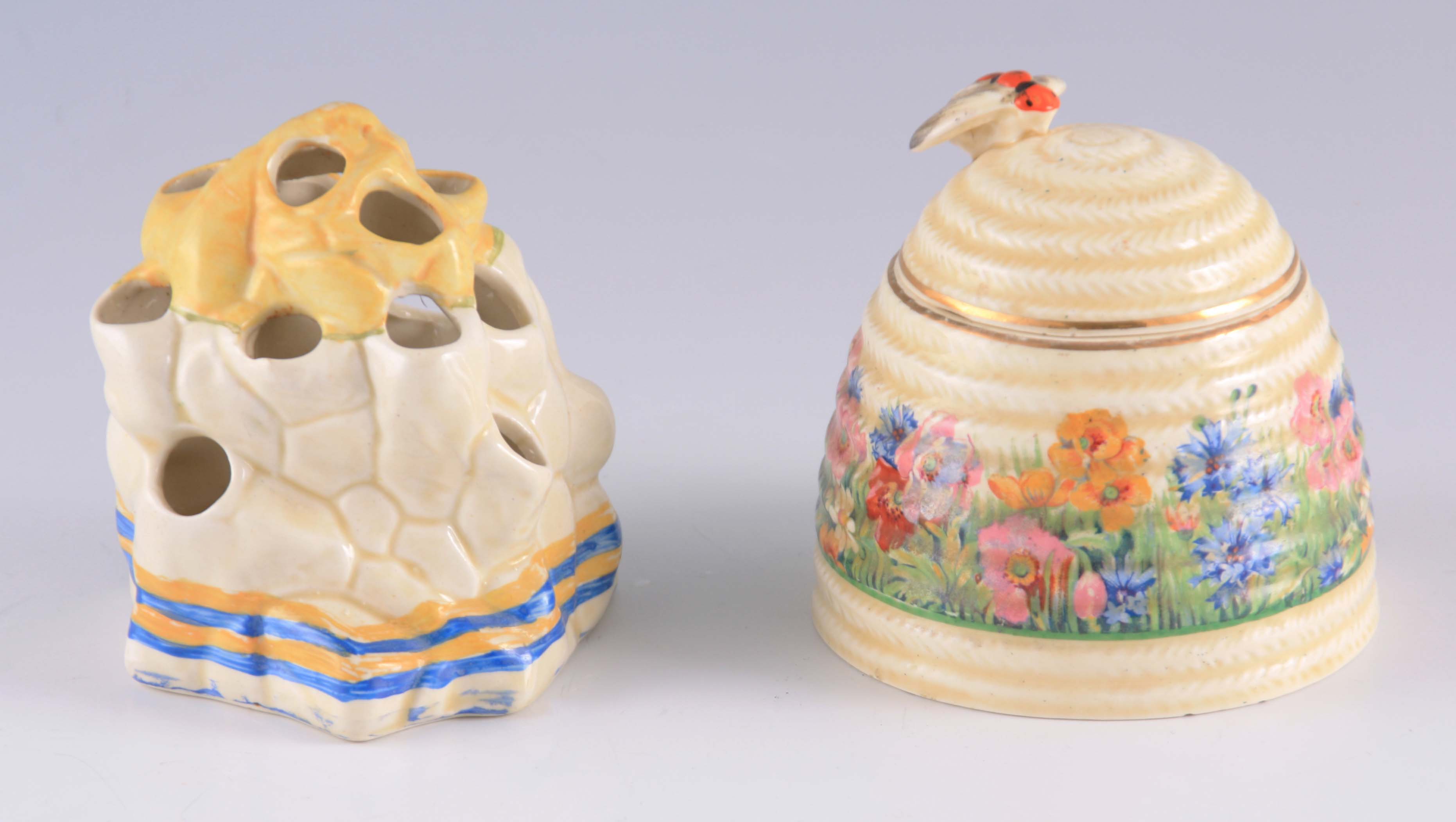 TWO PIECES OF 20TH CENTURY CLARICE CLIFF PORCELAIN comprising of a Honey Pot decorated with spring