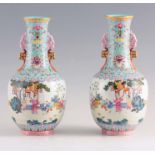 A FINE PAIR OF CHINESE REPUBLIC PERIOD FAMILLE ROSE SHOULDERED VASES WITH SLENDER TWO HANDLED