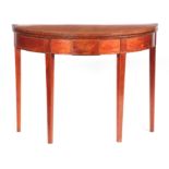 A GEORGE III FIGURED SATINWOOD ADAM STYLE DEMI LUNE TEA TABLE with cross-banded edge and panelled