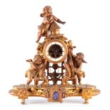A LATE 19TH CENTURY FRENCH FIGURAL SWINGING CHERUB MANTEL CLOCK the gilt metal case having three
