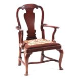 AN EARLY 18TH CENTURY WALNUT OPEN ARMCHAIR with scrolled shaped back splat, crook arms and drop in