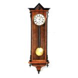 A 19TH CENTURY BURR WALNUT AND EBONISED VIENNA WALL REGULATOR WALL CLOCK having an architectural