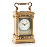 A GOOD LATE 19TH CENTURY FRENCH GILT BRASS AND CHAMPLEVE ENAMEL CARRIAGE CLOCK REPEATER. The