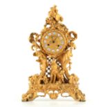 RAINGO FRERES PARIS. A 19TH CENTURY FRENCH ORMOLU EIGHT-DAY MANTEL CLOCK of shaped figural and