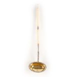 A WILLIAM IV SILVER AND IVORY PUNCH LADLE with turned baluster ivory handle and foliate relief