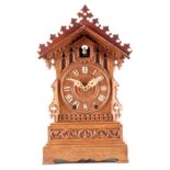 A 19TH CENTURY DOUBLE FUSEE CUCKOO CLOCK attributed to Johann Beha, the gothic oak case with
