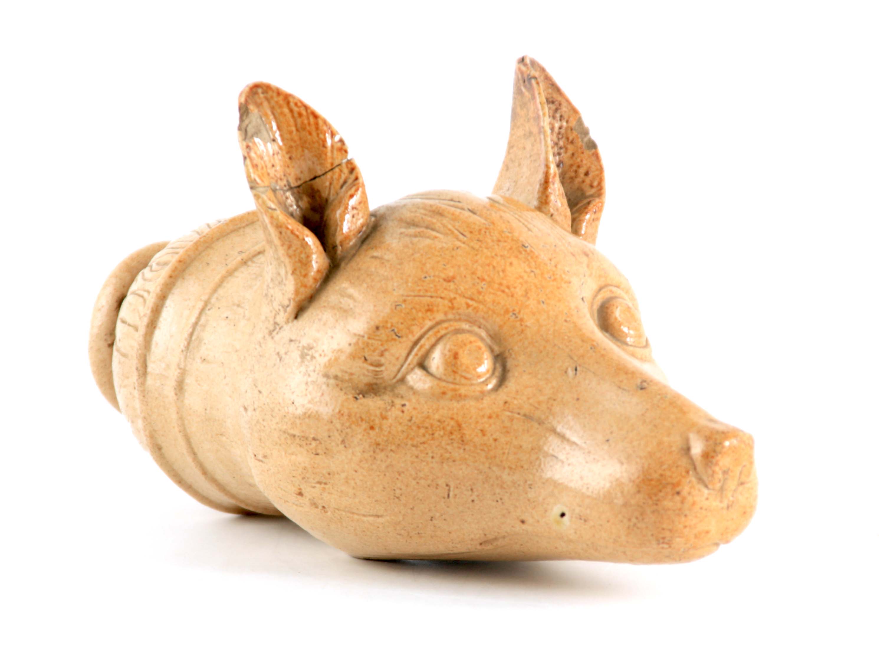 AN EARLY 19TH CENTURY STONEWARE FOX HEAD STIRRUP CUP 19cm overall.