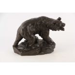 A BRONZE SCULPTURE OF A WOUNDED BEAR mounted on a naturalistic base - signed Peris? 40cm wide 29cm