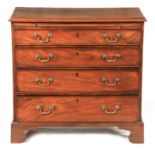 A GEORGE III MAHOGANY CHEST OF DRAWERS with moulded top above a brushing slide and four long