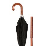 A 20TH CENTURY WOOD CONVERTABLE WALKING STICK/PARASOL with collapsible stepped shaft revealing a