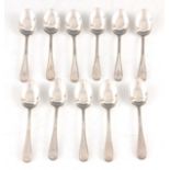 A VICTORIAN SET OF ELEVEN SINGLE STRUCK BEAD EDGE TEASPOONS initialled "R" by J Williams and Co,