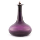 AN AMETHYST GLASS PORT DECANTER WITH SILVER METAL STOPPER of square form with silver metal mounted