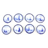 A SET OF EIGHT ROYAL CROWN DERBY SMALL HANGING PLATES painted with differing sailboats on a blue