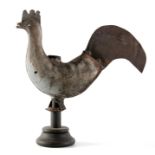 A 19TH CENTURY FULL BODIED COCKEREL METAL WEATHER VAIN mounted on a later base 53cm wide 53cm high