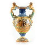 A LATE 19TH CENTURY ITALIAN MAJOLICA PEDESTAL VASE ATTRIBUTED TO CANTAGALLI with winged cherub