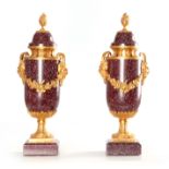 A FINE PAIR OF 19TH CENTURY FRENCH PORPHYRY AND ORMOLU MOUNTED URNS AND COVERS with mask head side