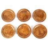 A SET OF SIX 19TH CENTURY TREEN WARE FRUITWOOD PLATES with raised borders 28cm diameter.