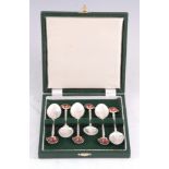 AN ELIZABETH II CASED SET OF SIX SILVER AND ENAMEL SPOONS with "Super Materiam Inglis Triumphans Est
