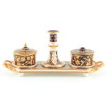 AN EARLY 20TH CENTURY REGENCY DERBY INKSTAND decorated with royal blue and gilt leaf work decoration