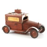 AN EARLY 20TH CENTURY WOODEN SILVER MOUNTED VINTAGE CAR DESK TIDY with fitted music box to the