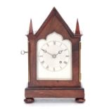 A SMALL 19TH CENTURY ENGLISH ROSEWOOD FUSEE MANTEL CLOCK the gothic style case with architectural