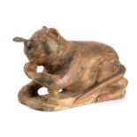 AN UNUSUAL EASTERN CARVED WOOD SCULPTURE OF A CAT with cast iron shaped tongue 40cm wide 27cm high.