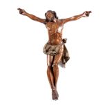 AN EARLY 15TH/16TH CENTURY CONTINENTAL CARVED OAK AND POLYCHROME FIGURE OF CHRIST 108cm high 92cm