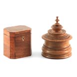 A GOERGE III CROSS-BANDED MAHOGANY TEA CADDY with clipped corners and a hinged lid revealing a
