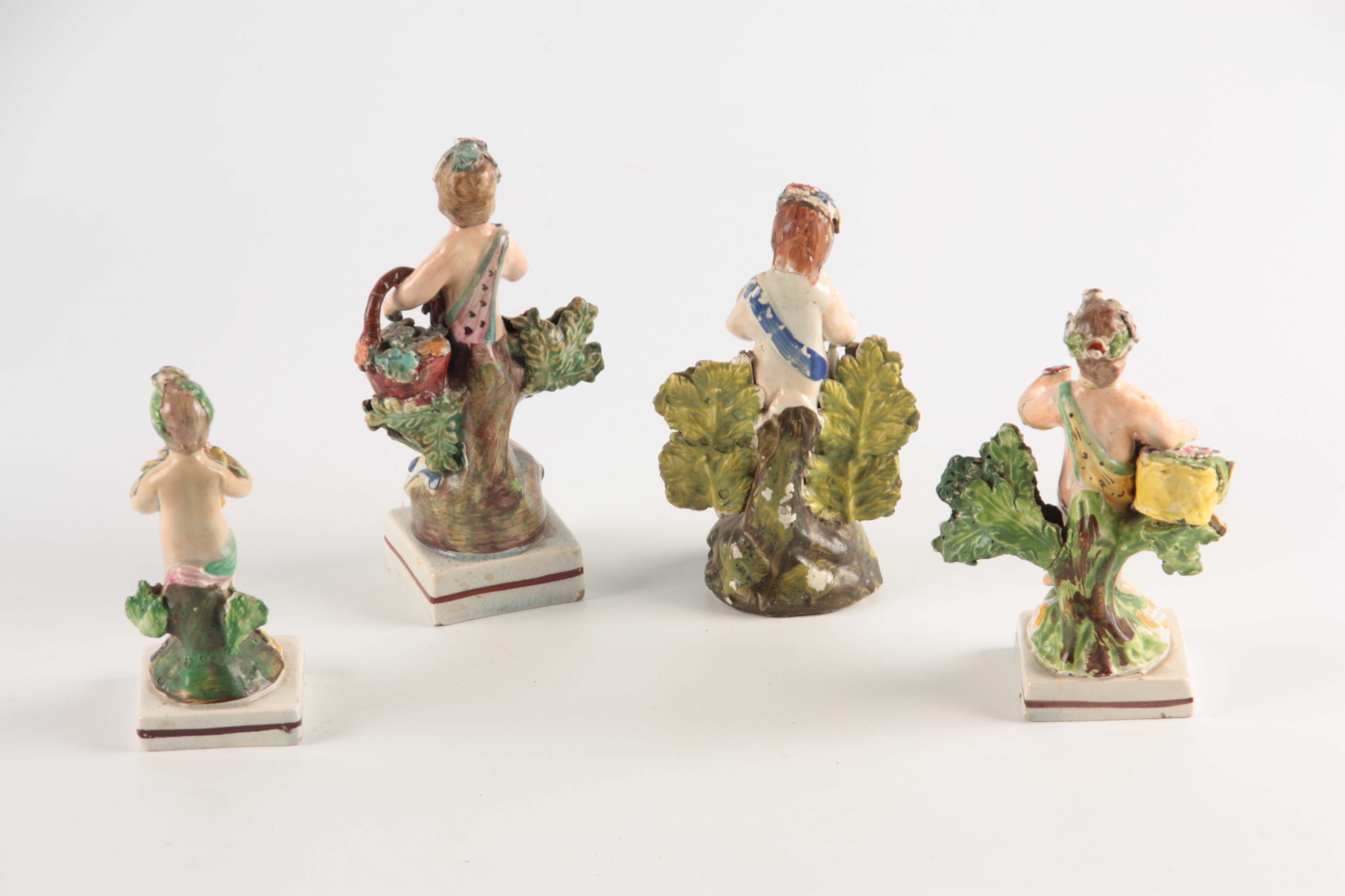 A SELECTION OF FOUR EARLY 19TH CENTURY STAFFORDSHIRE PEARLWARE FIGURES of cherubs holding various - Image 5 of 5