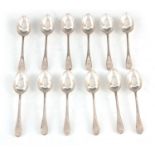 A GOERGE V SET OF TWELVE DOUBLE STRUCK BEAD EDGE TEASPOONS by Walker and Hall, Sheffield 1923, 314