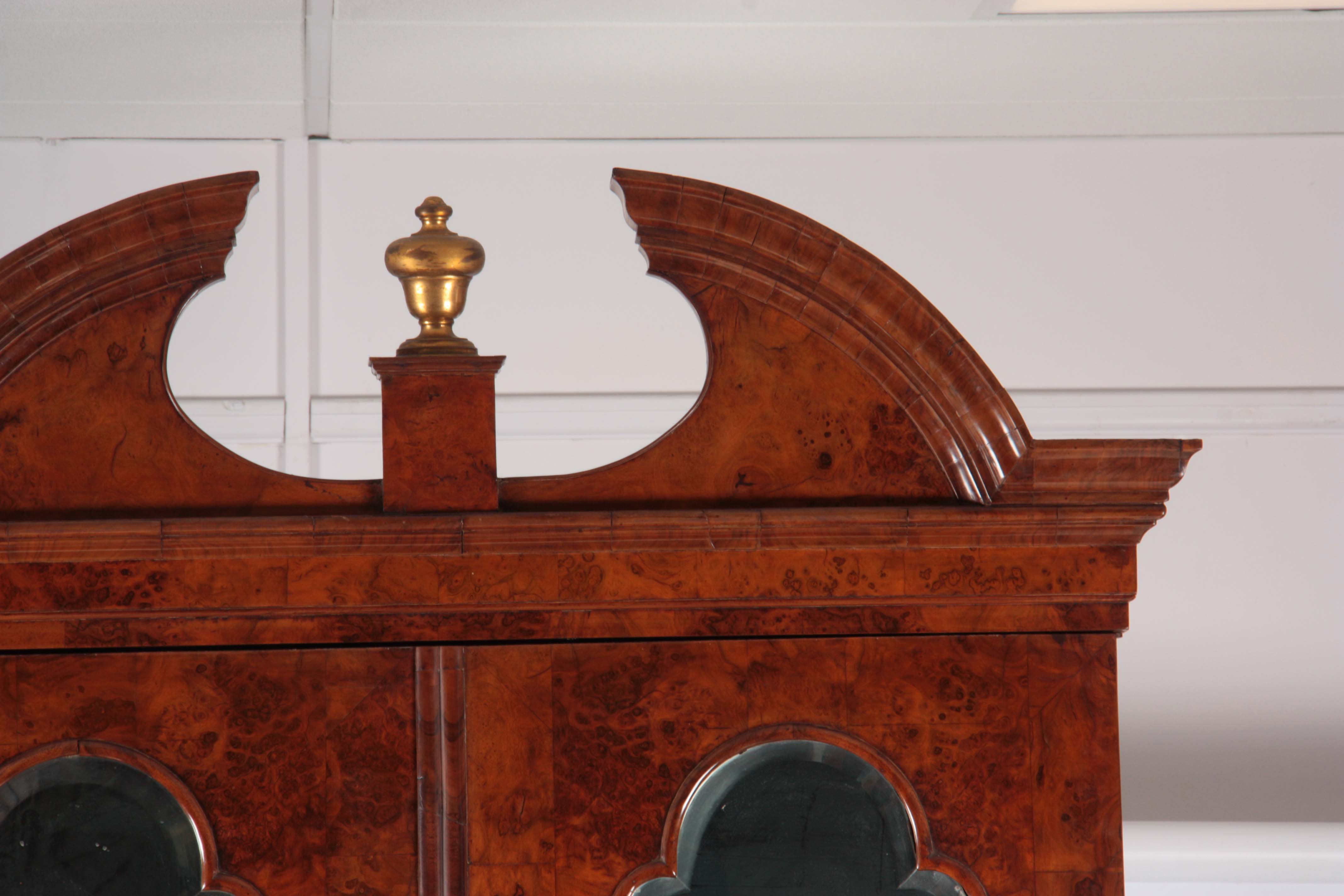 A WILLIAM AND MARY BURR WALNUT BUREAU BOOKCASE with broken arch pediment above shaped mirrored doors - Image 7 of 14