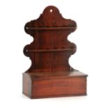 AN 18TH CENTURY ELM SPOON RACK with shaped back above a box front with hinged lid 34.5cm wide 49cm