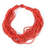 A 20TH CENTURY MULTI STRING BEAD CORAL NECKLACE 50cm overall.