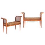 A PAIR OF REGENCY MAHOGANY WINDOW SEATS having raised end supports with twisted reeded legs and