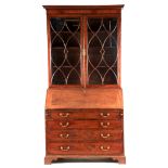 A GEORGE III MAHOGANY BUREAU BOOKCASE with moulded cornice above two astragal glazed doors revealing