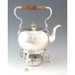 A GEORGE I SILVER KETTLE ON STAND the hinged swan neck handle and turned wooden grip above a