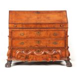 AN 18TH CENTURY DUTCH WALNUT BUREAU of two section form, the upper part having an angled fall