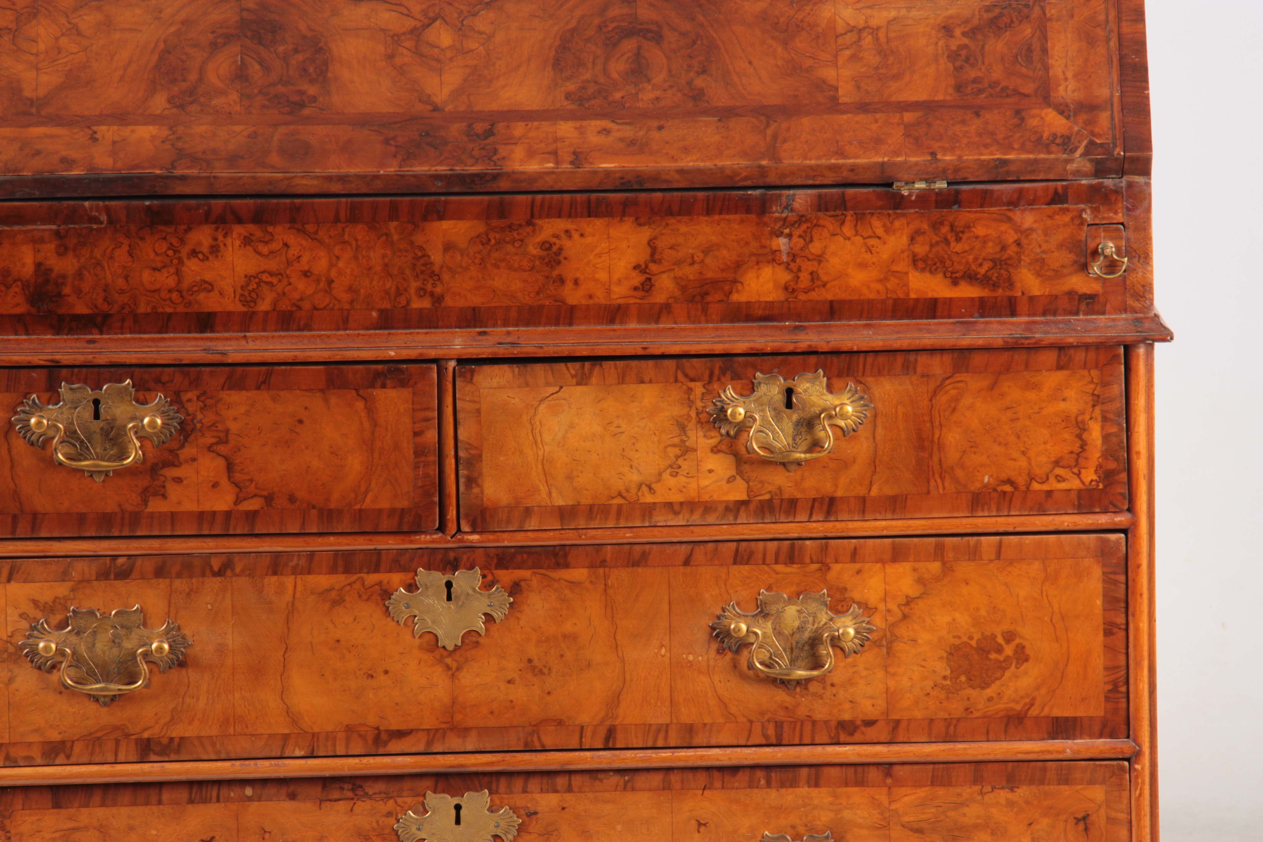 A WILLIAM AND MARY BURR WALNUT BUREAU BOOKCASE with broken arch pediment above shaped mirrored doors - Image 6 of 14