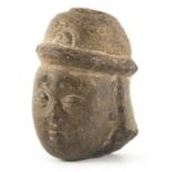 AN EARLY CARVED STONE TIBETAN HEAD 10cm high.